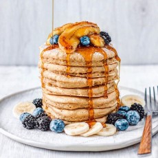 Fluffy-Banana-Pancakes-Topped-with-Caramelized-Bananas-Blueberries-Blackberries-Maple-Syrup.jpg