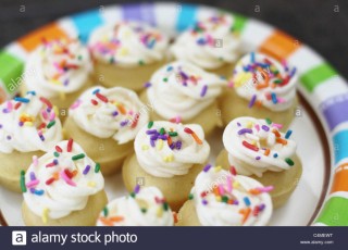 a-plate-of-colorful-mini-cupcakes-C4MEWT.jpg