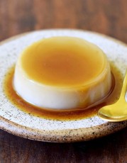 eggless-flan-on-a-plate-with-a-spoon.jpg