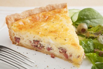Slice of Quiche Lorraine on a Plate with Salad