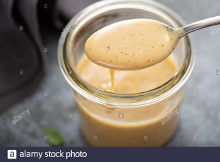 homemade-creamy-honey-mustard-sauce-in-a-glass-jar-2B3RK2J.jpg