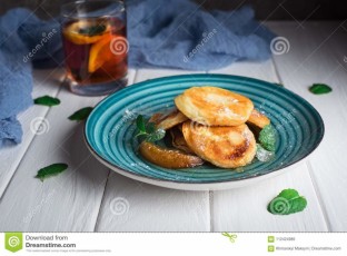 pancakes-caramelized-pear-tea-lemon-mint-selective-focus-wooden-white-background-top-view-pancakes-112424985.jpg