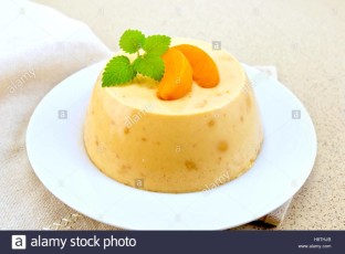 panna-cotta-apricot-with-mint-on-table-H8THJB.jpg