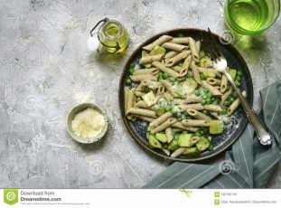 whole-wheat-pasta-penne-zucchini-green-pea-plate-over-grey-slate-stone-concrete-background-top-view-whole-wheat-122152142.jpg